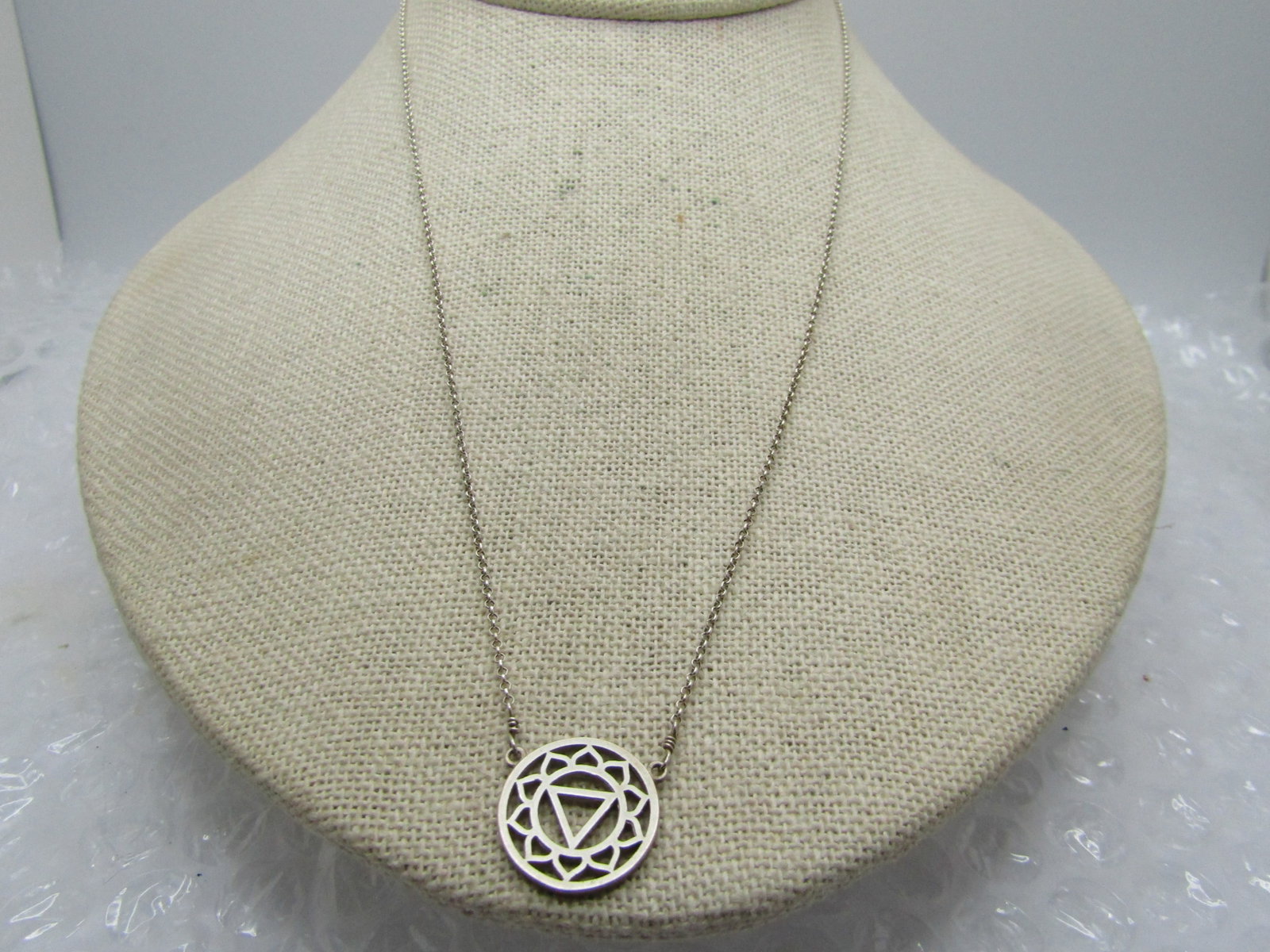 Vintage Sterling Triangular Scrolled Necklace, 18": Title: Vintage Sterling Triangular Scrolled Necklace, 18" Description: Vintage Sterling Triangular Scrolled Necklace, 18". Round pendant that is appx. 5/8" round with a center open triangle and an