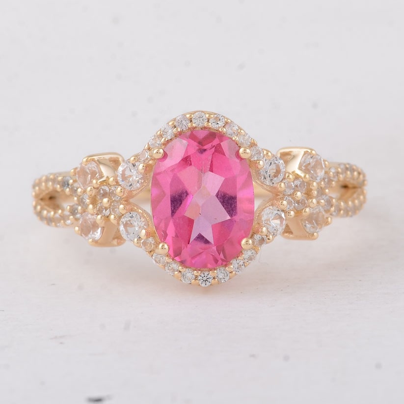 2.18 Ct Oval Pink Topaz 9K Gold Ring: 2.18 Total Carat Pink Topaz 9K Gold Ring Specifications: Total Weight 2.31 g Center Gemstone Pink Topaz Gemstone Carat Weight 1.67 Carats Gemstone Measurements 8X6 mm Additional Gemstones White Sapphi