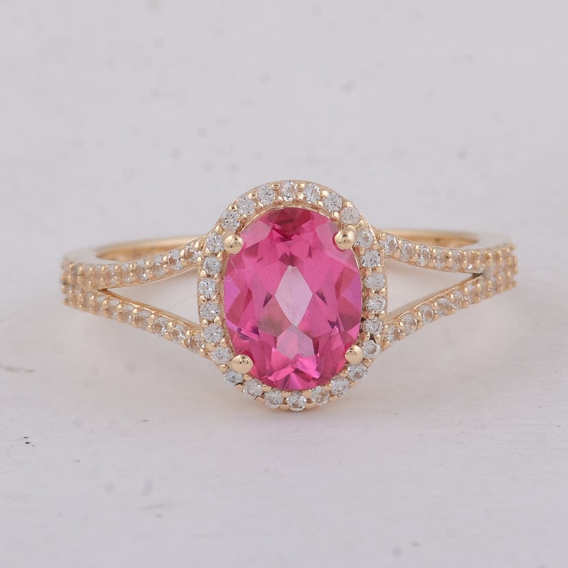 1.91 Ct Oval Pink Topaz 9K Gold Ring: 1.91 Total Carat Pink Topaz 9K Gold Ring Specifications: Total Weight 2.3 g Center Gemstone Pink Topaz Gemstone Carat Weight 1.64 Carats Gemstone Measurements 8X6 mm Additional Gemstones White Sapphir