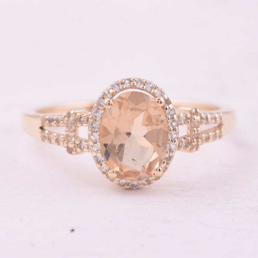 1.24 Ct Oval Tourmaline 9K Gold Ring: 1.24 Total Carat Tourmaline 9K Gold Ring Specifications: Total Weight 1.861 g Center Gemstone Tourmaline Gemstone Carat Weight 1.04 Carats Gemstone Measurements 8X6 mm Additional Gemstones White Sapph