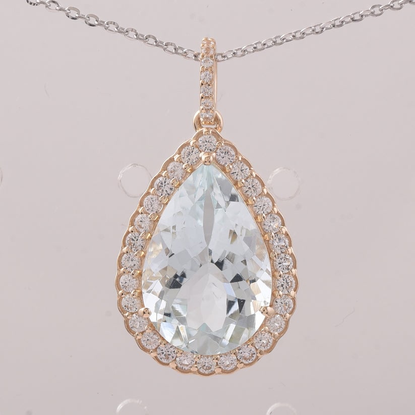 5.47 Ct Pear Aquamarine 9K Gold Pendant: 5.47 Total Carat Aquamarine 9K Gold Pendant Specifications: Total Weight 2.219 g Center Gemstone Aquamarine Gemstone Carat Weight 4.92 Carats Gemstone Measurements 14.90X10X6.60 mm Additional Gemstone