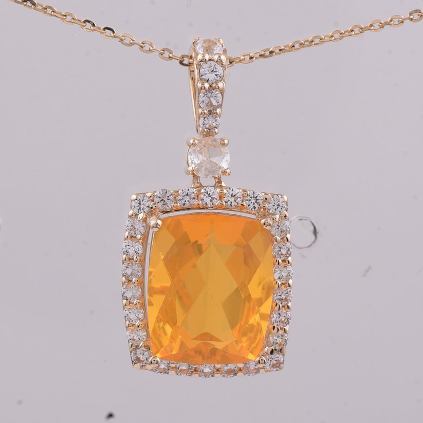 3.43 Ct Cushion Fire Opal 9K Gold Pendant: 3.43 Total Carat Fire Opal 9K Gold Pendant Specifications: Total Weight 1.962 Center Gemstone Fire Opal Gemstone Carat Weight 2.93 Carats Gemstone Measurements 10.80X9X6.20 mm Additional Gemstones Whi