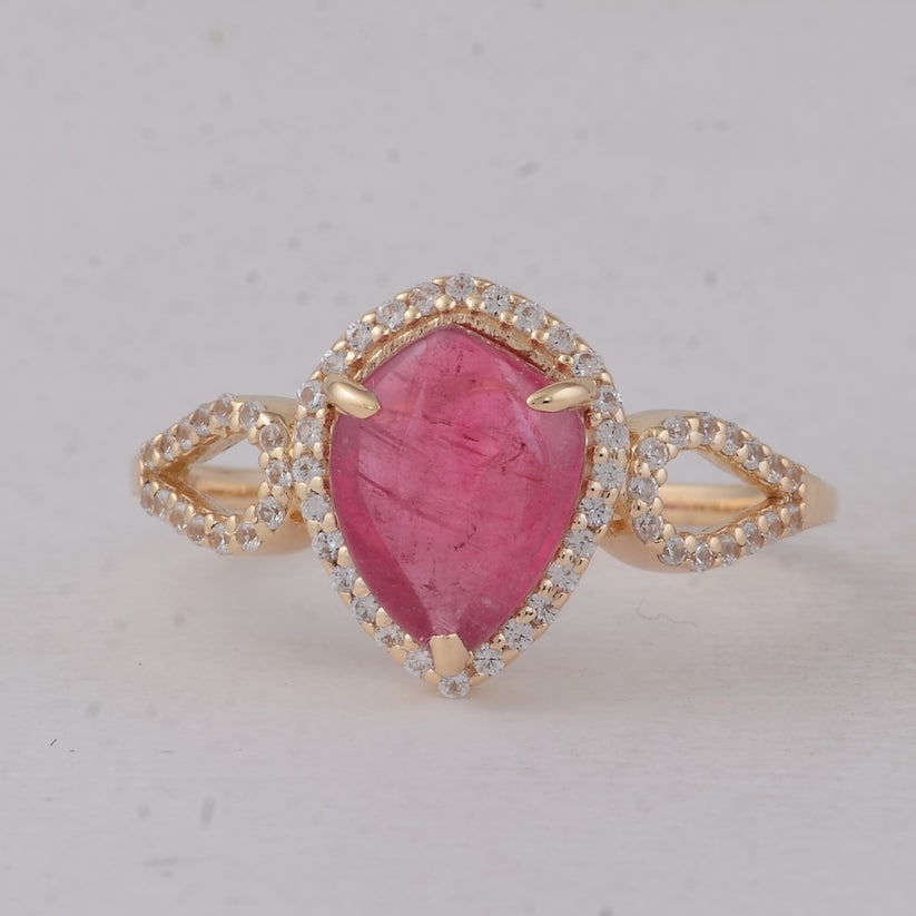 1.99 Ct Fancy Cab Pink Tourmaline 9K Gold Ring: 1.99 Total Carat Pink Tourmaline 9K Gold Ring Specifications: Total Weight 2.111 g Center Gemstone Pink Tourmaline Gemstone Carat Weight 1.74 Carats Gemstone Measurements 9.20X7.10 mm Additional