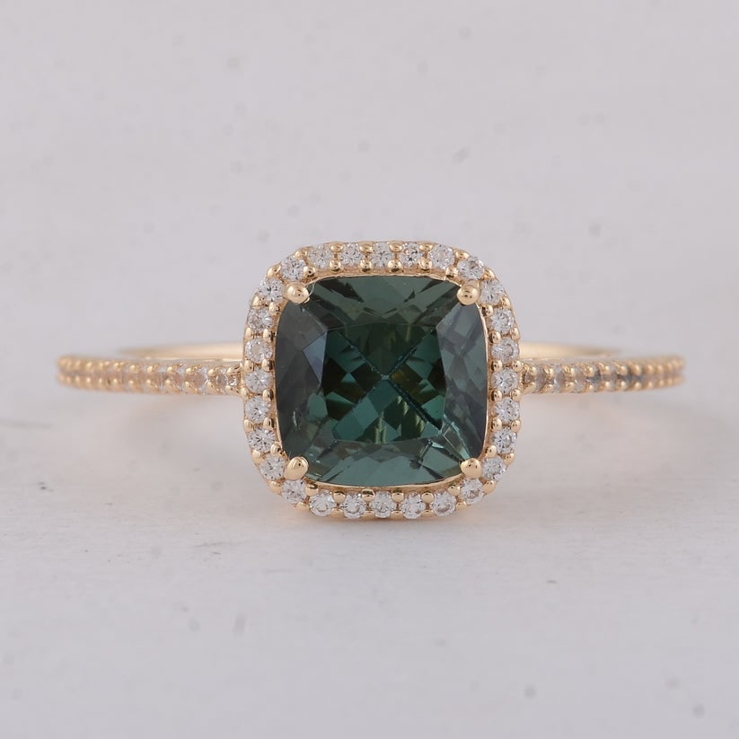 2.14 Ct Cushion Tourmaline 9K Gold Ring: 2.14 Total Carat Tourmaline 9K Gold Ring Specifications: Total Weight 2.08 g Center Gemstone Tourmaline Gemstone Carat Weight 1.9 Carats Gemstone Measurements 7X7X6 mm Additional Gemstones White