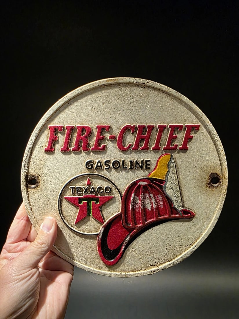 Cast Iron Round Texaco Fire Chief Gas Oil Sign Plaque: 9 1/2" round 1/4" thick Such a neat reproduction cast iron plaque/sign. This sign is all solid cast iron. Hand painted, wonderful signs of wear and distress. Hard to tell its age! Reserve: $25.00 Ship