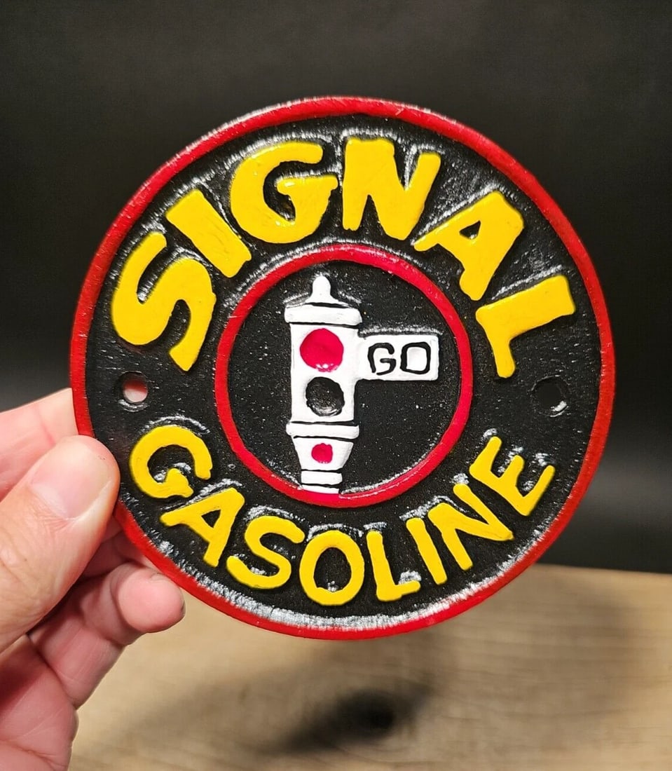 Cast Iron Signal Gasoline Gas Oil Sign Plaque: 4 1/2" Round Such a neat reproduction cast iron plaque/sign. This sign is all solid cast iron. Hand painted, wonderful signs of wear and distress. Hard to tell its age! Reserve: $15.00 Shipping: