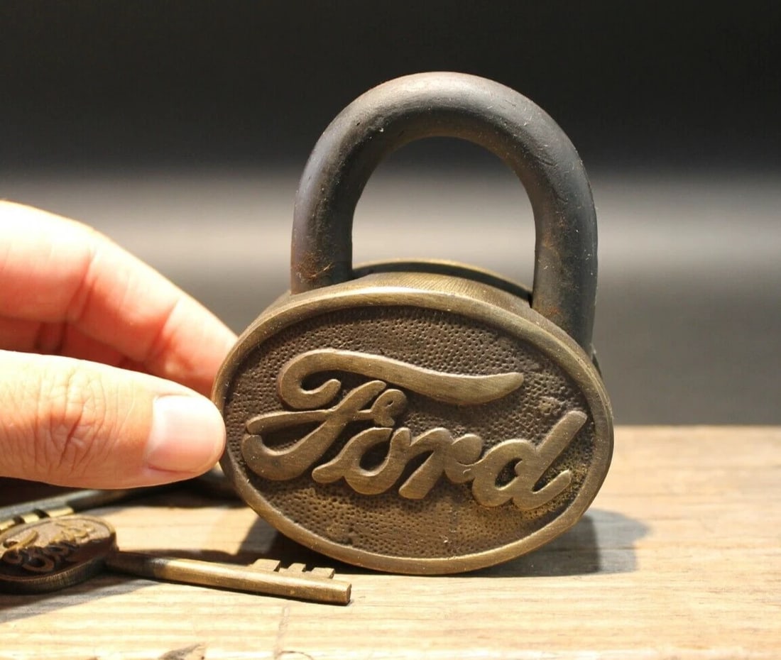 Brass & Iron Trunk Chest Box Ford Lock Padlock: 3" Wide x 4" tall x 1 1/4" thick Just wonderful heavy duty antique reproduction iron padlock with keys. Fully functional, looks great on an old truck or chest! Reserve: $40.00 Shipping: Domestic: Flat
