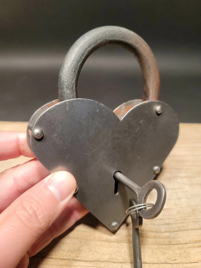 Cast Iron Steel Heart Bridge Padlock Lock & Key: 5" tall x 3 1/4" Wide Nice reproduction heart shaped cast iron and steel padlock! This lock is fully functional! Hard to tell its age. Heavy iron and brass. Great aged patina throughout. Limited quant