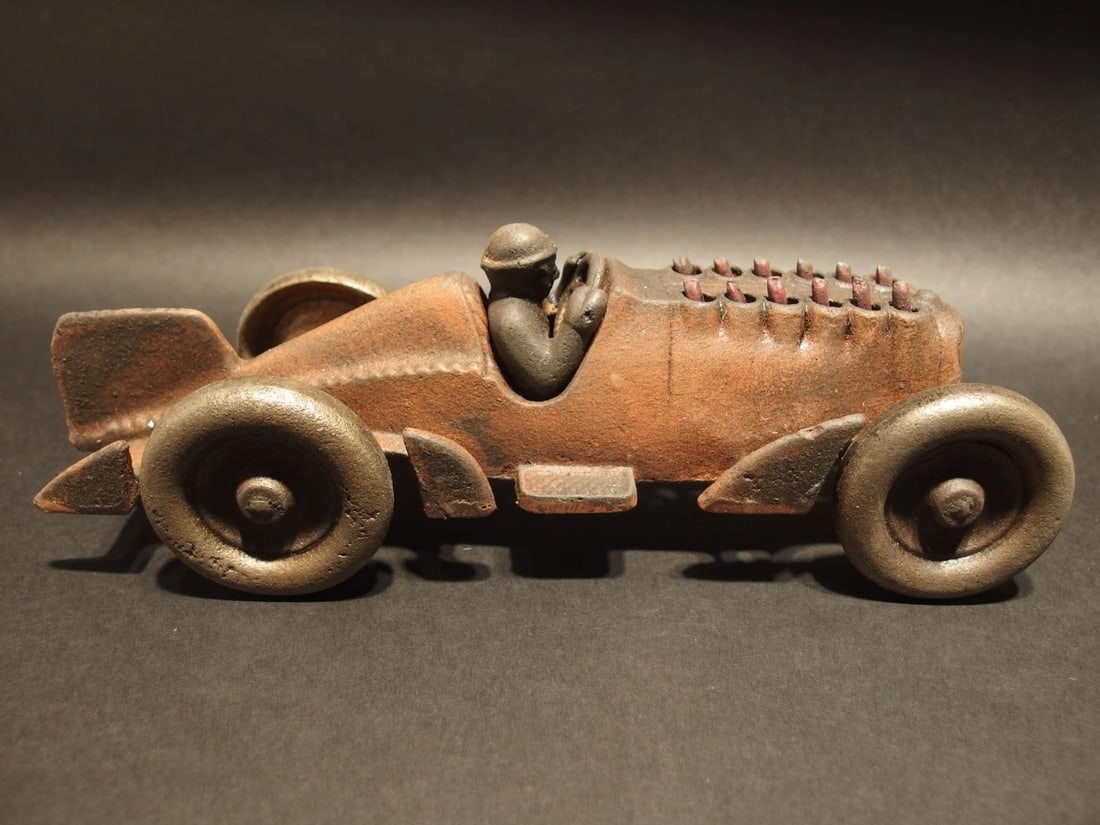 Cast Iron Toy Race Car w Moving Flames "Hubley": 10 1/4" Long x 3 1/2" Wide 4" Tall 2 lbs 13 oz Such a neat reproduction cast iron car! As you can see this heavy cast iron car was wonderfully hand painted and distressed to look original. The car is 