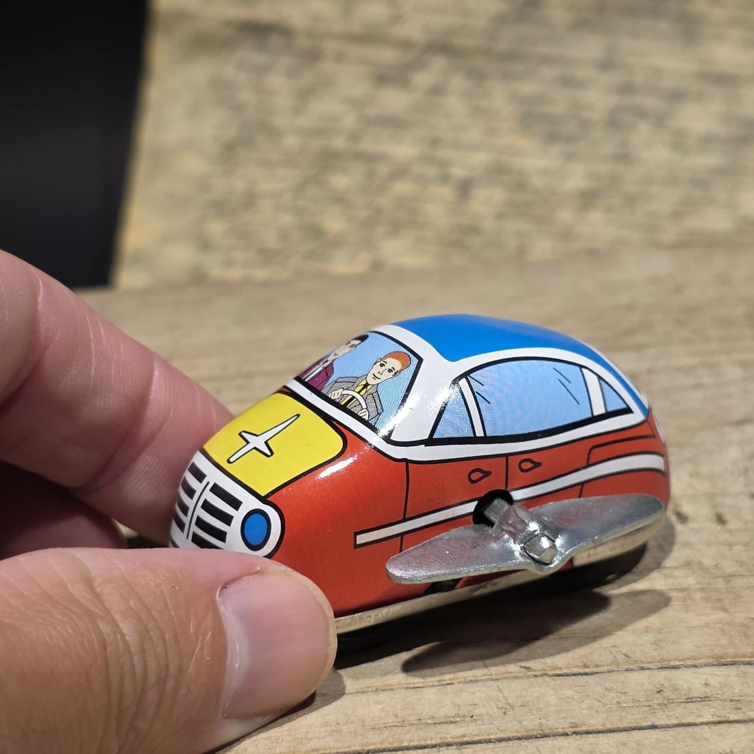 Tin Litho Wind-Up Toy Mechanical Car: Reproduction Vintage-style tin lithograph ambulance toy featuring colorful printed graphics and a side-mounted wind-up mechanism. Emergency vehicle toys became popular during the mid-20th century as m