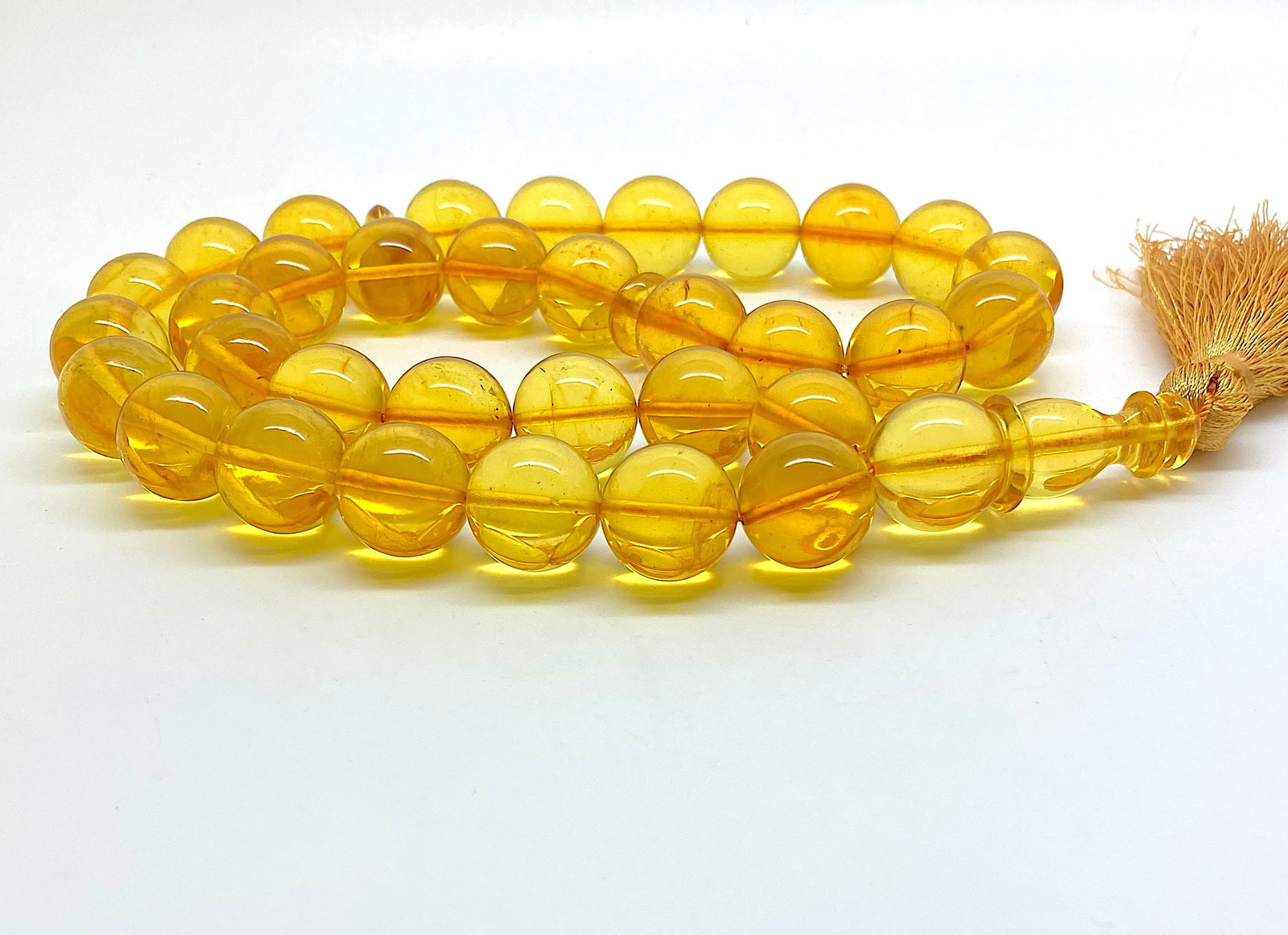 Fascinating Vintage Amber Tesbih made from Round Amber beads: Title:Fascinating Vintage Amber Tesbih made from Round Amber beads Metal:None Gemstone:Amber Weight:57.1 g Size:Bead size: 14.0 mm Bead size: 0.551 inches Made of:(Reconstituted Amber or Whole