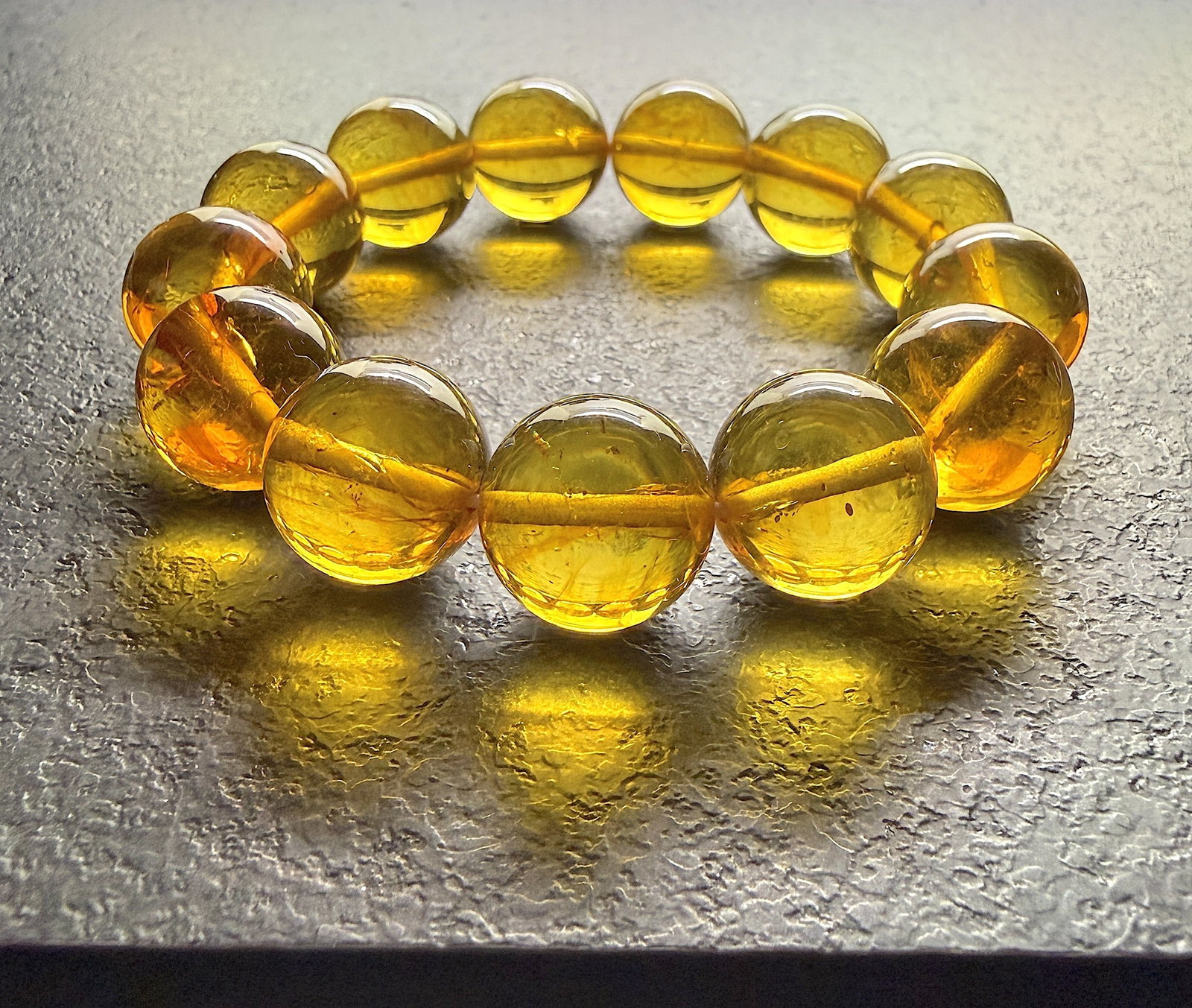 Phenomenal Amber Bracelet: Title:Phenomenal Amber Bracelet Metal:None Gemstone:Reconstituted Amber Weight:42.0 g Size:17mm Made of:(Reconstituted Amber or Whole Stone):Reconstituted Amber Additional information:Phenomenal