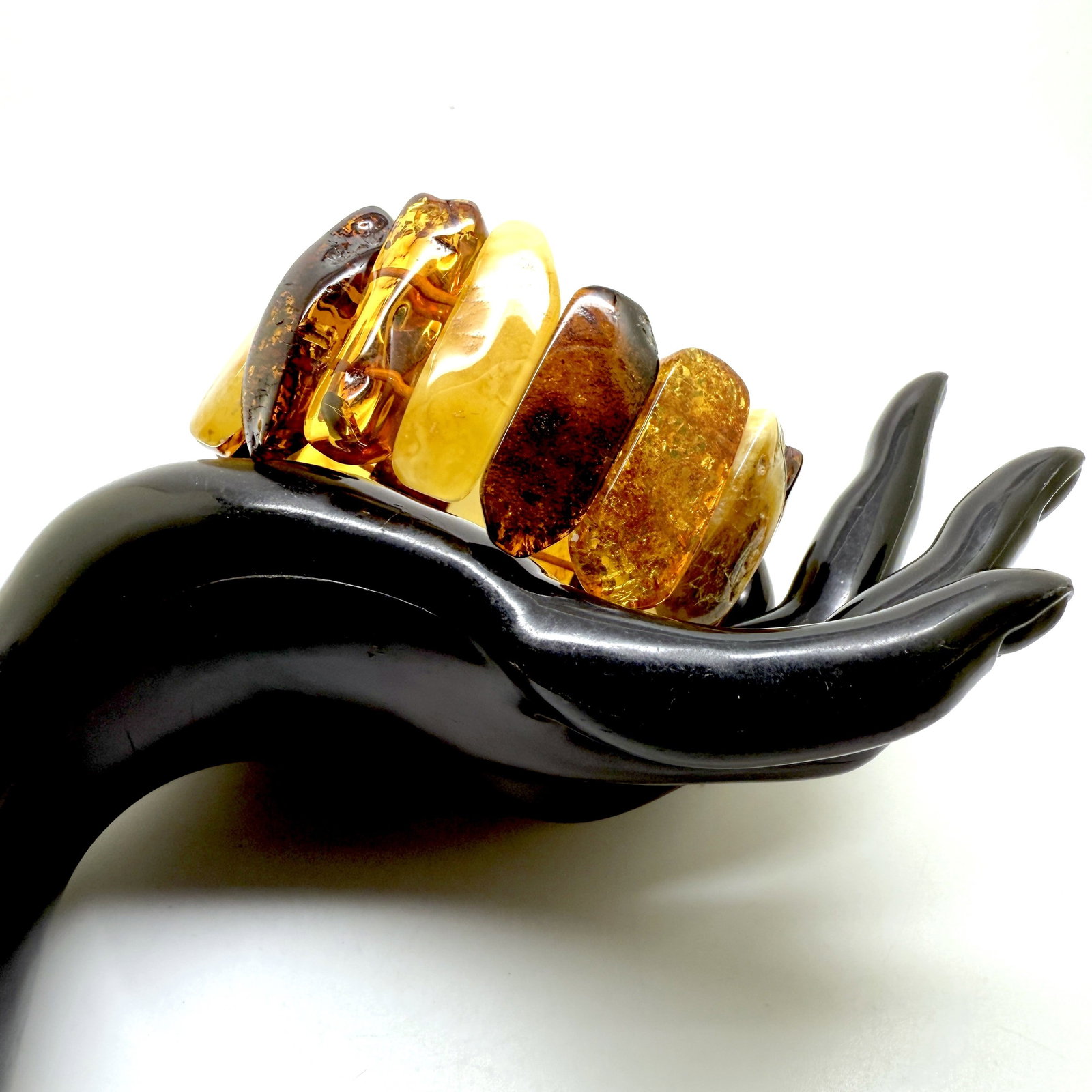 Phenomenal Amber Cuff Bracelet: Title:Phenomenal Amber Cuff Bracelet Metal:None Gemstone:Whole Stone Weight:33.5 g Size:70x 35mm Made of:(Reconstituted Amber or Whole Stone):Natural Amber Additional information:Amber does not contai