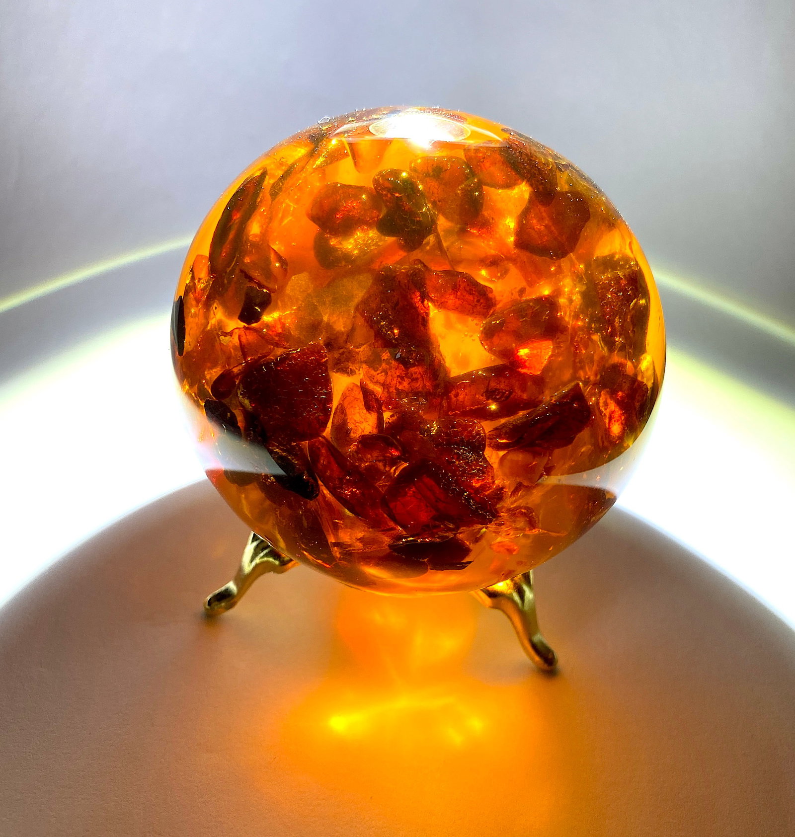 Unique and Remarkable Amber Ball on a pedestal: Title:Unique and Remarkable Amber Ball on a pedestal Metal:None Gemstone:Amber Weight:249.5 g Size:Size: 73.7 x 73.7 x 73.7 mm Size: 2.902 x 2.902 x 2.902 inches Made of:(Reconstituted Amber or Whole