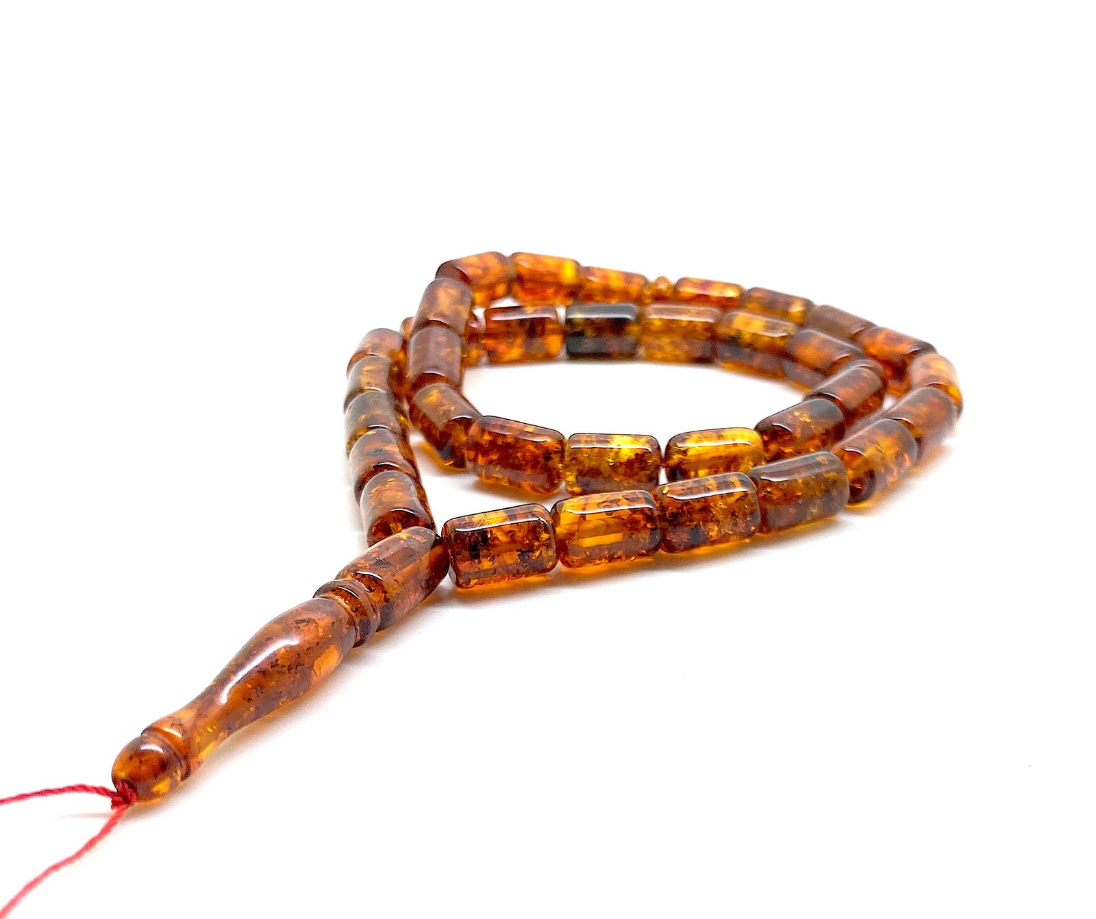 Staggering Unique Antique Amber Tesbih made from Barrel shaped Amber beads: Title:Staggering Unique Antique Amber Tesbih made from Barrel shaped Amber beads Metal:None Gemstone:Amber Weight:21.7 g Size:Bead size: 12.0 x 8.0 mm Bead size: 0.472 x 0.315 inches Made