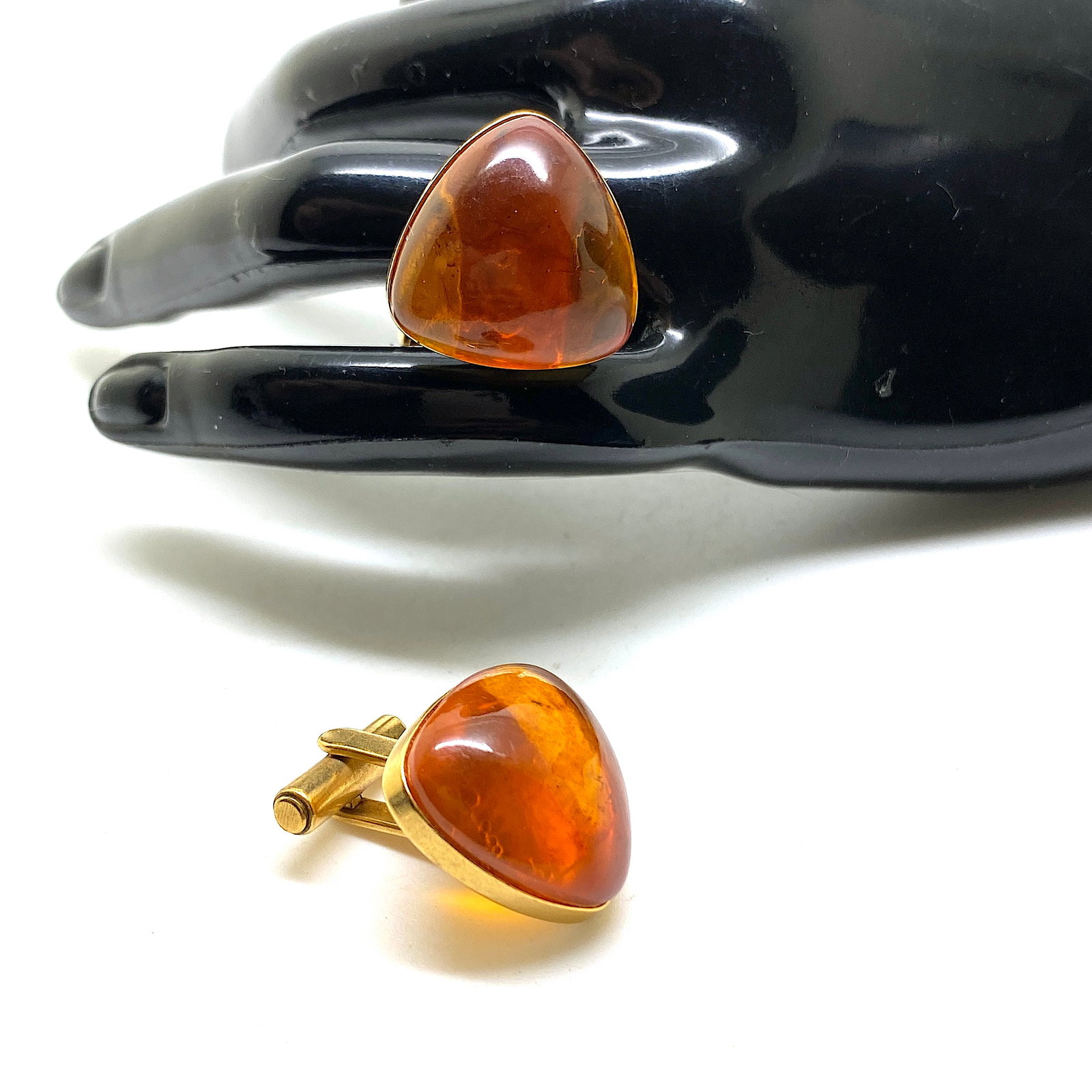Astonishing Vintage Reuleaux shaped Amber Cufflinks: Title:Astonishing Vintage Reuleaux shaped Amber Cufflinks Metal:None Gemstone:Amber Weight:10.4 g Size:Size: 19.0 x 19.0 x 24.0 mm Size: 0.748 x 0.748 x 0.945 inches Made of:(Reconstituted Amber or