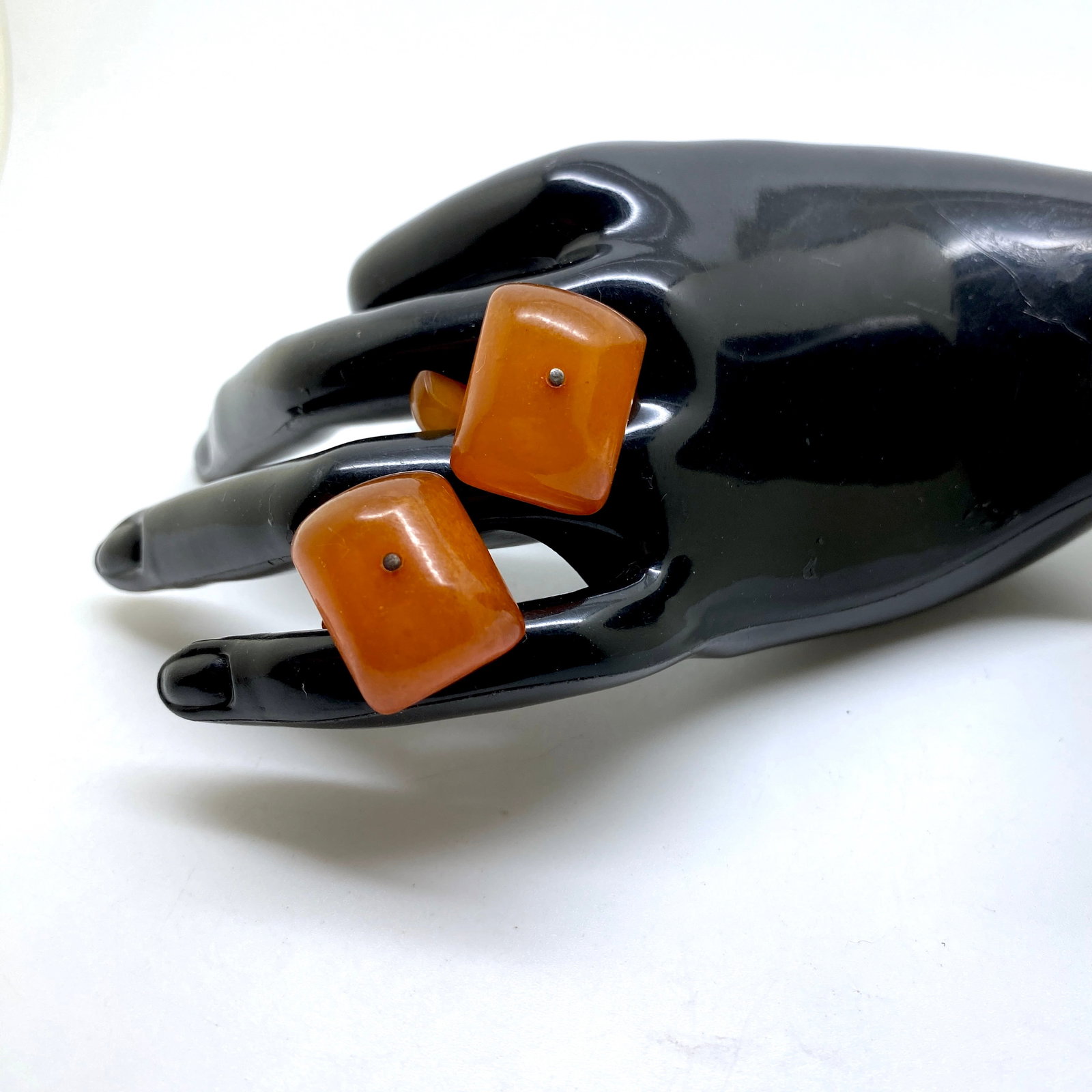 Alluring Amber Cufflinks: Title:Alluring Amber Cufflinks Metal:None Gemstone:Amber Weight:6.6 g Size:Size: 20.0 x 16.0 x 30.0 mm Size: 0.787 x 0.63 x 1.181 inches Made of:(Reconstituted Amber or Whole Stone):Reconstituted