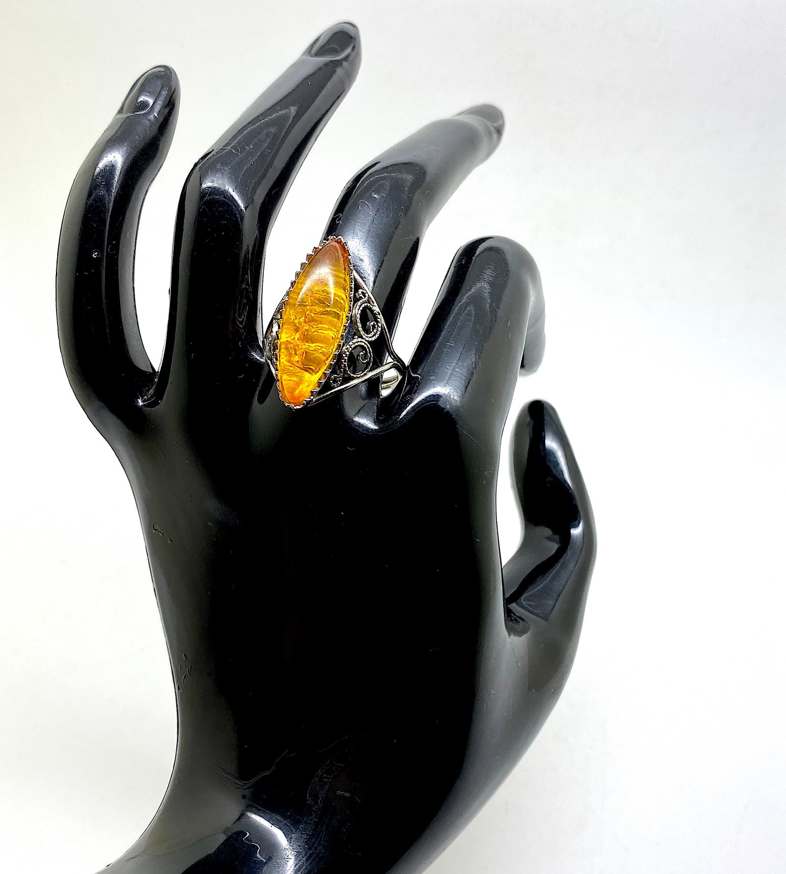 Phenomenal Amber Ring: Title:Phenomenal Amber Ring Metal:Metal Gemstone:Amber Weight:2.85 g Size:Inner diameter: 19 mm Size: 26.0 x 25.25 x 19.75 mm Size: 1.024 x 0.994 x 0.778 inches Inner diameter: 0.748 inches Made