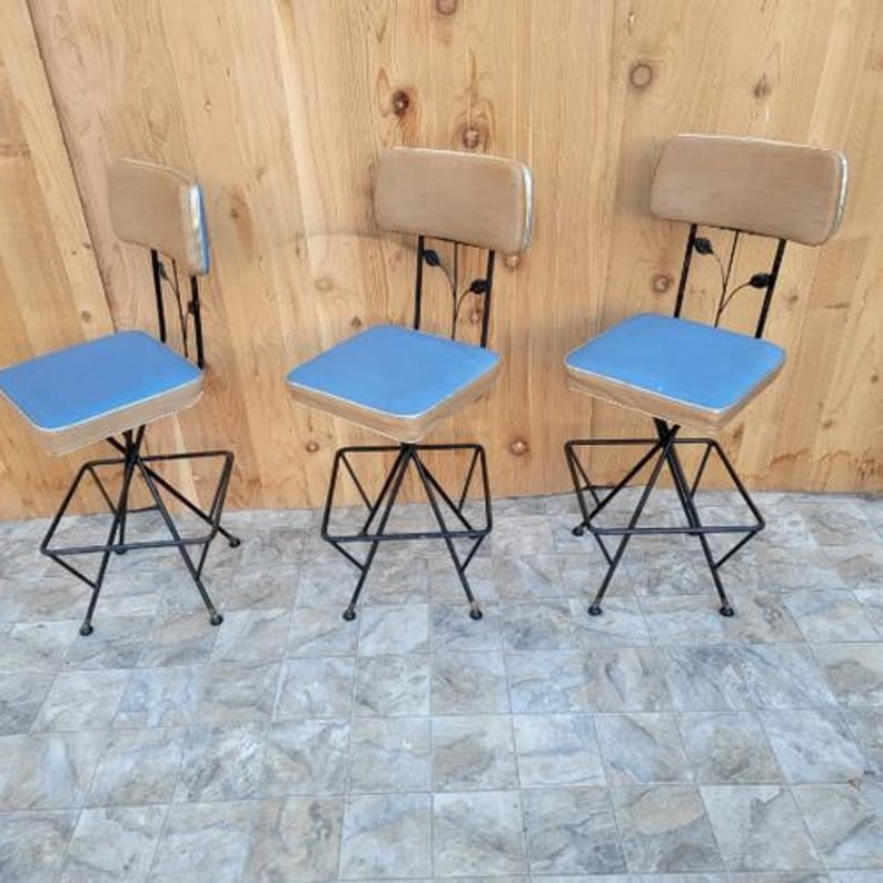 Vintage Retro Swivel Bar Stools - Set of 3: Vintage Retro Swivel Bar Stools - Set of 3 Cool vintage blue/tan bar stools with sculptural iron frames, leaf and stem back accents. Contact us for custom upholstery. Circa Mid 20th Century