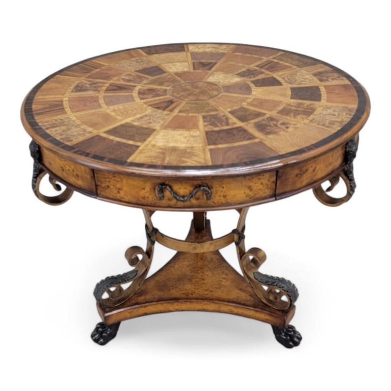 Vintage Theodore Alexander Caryatid Iron and Walnut Burl Table: Vintage Theodore Alexander Caryatid Iron and Walnut Burl Round Drum Center Paw Foot Table This table has been carved from walnut and burl wood with a beautiful wheel design on the table face. The