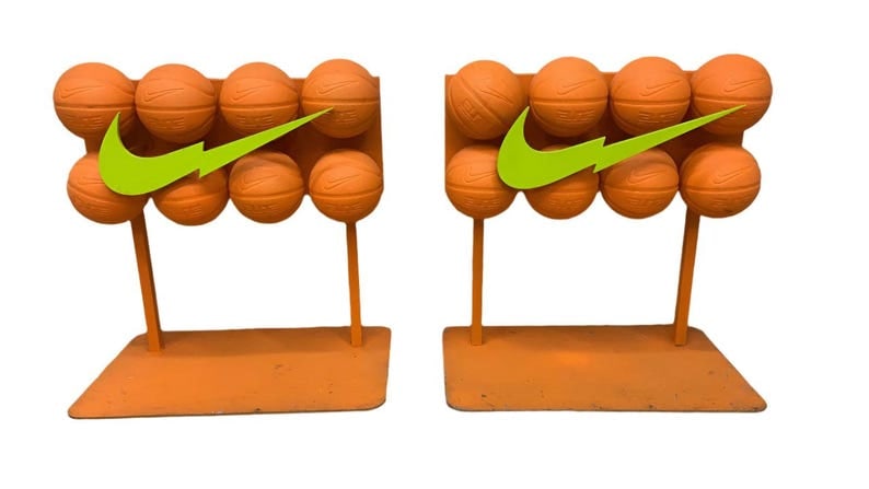 Vintage Nike Basketball Shelf End Table - Set of 2: Vintage Nike Basketball Shelf Side/End Table - Set of 2 Vintage, hip orange and yellow pair of Nike basketball displays. Each piece comprises of a heavy orange painted steel base and eight mounted