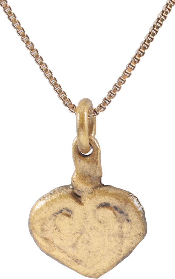 ANCIENT VIKING HEART PENDANT NECKLACE 11TH CENTURY AD: A fine example in its fully evolved form. Just under 5/8" (0.61") height. Iconic fully developed cusped top full form. The broad raised borders forming the cusp and continuing as the top members of th
