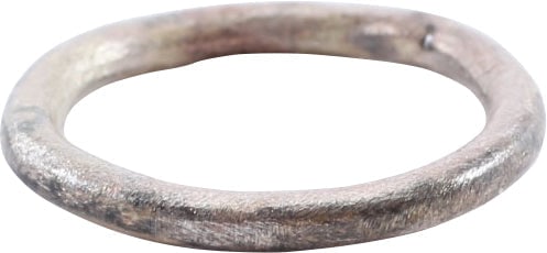 VIKING BEARD RING, 9TH-11TH CENTURY: Round, one side is flat and the other rounded. 0.50" inside diameter and 0.61" outside. The use of beard rings by Vikings is well documented though very few genuine examples survive. Professionally