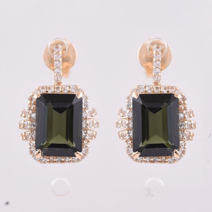 3.48 Ct Octagon Tourmaline 9K Gold Earrings: 3.48 Total Carat Tourmaline 9K Gold Earrings Specifications: Total Weight 2.637 g Center Gemstone Tourmaline Gemstone Carat Weight 3.09 Carats Gemstone Measurements 8X6 mm Additional Gemstones White S