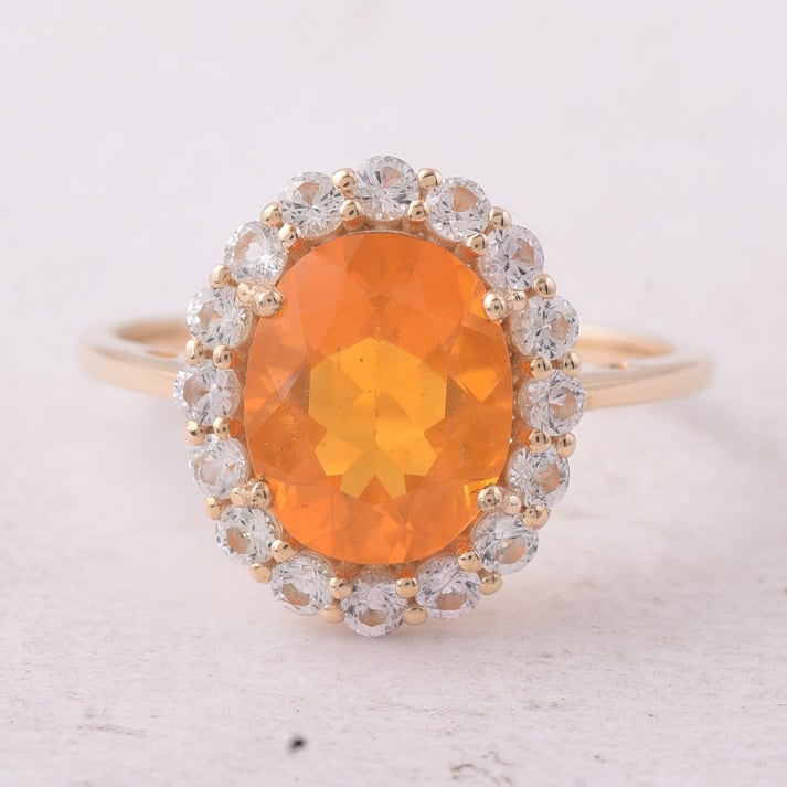 2.39 Ct Oval Fire Opal 9K Gold Ring: 2.39 Total Carat Fire Opal 9K Gold Ring Specifications: Total Weight 2.319 g Center Gemstone Fire Opal Gemstone Carat Weight 1.68 Carats Gemstone Measurements 10X8X5.50 mm Additional Gemstones White S