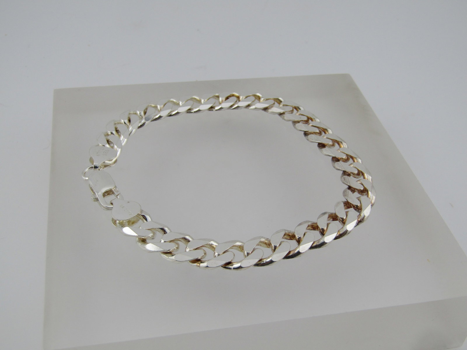 Sterling Silver Cuban Curb Link Bracelet, 8.25" , 9.2mm, Signed: Title:Sterling Silver Cuban Curb Link Bracelet, 8.25" , 9.2mm, Signed Description:Sterling Silver Cuban Curb Link Bracelet, 8.25" , 9.2mm, Signed KA 1772. This is in unworn condition with a chunky lob