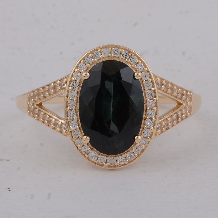 2.49 Ct Oval Tourmaline 9K Gold Ring: 2.49 Total Carat Tourmaline 9K Gold Ring Specifications: Total Weight 2.57 g Center Gemstone Tourmaline Gemstone Carat Weight 2.27 Carats Gemstone Measurements 10X7X5 mm Additional Gemstones White Sap