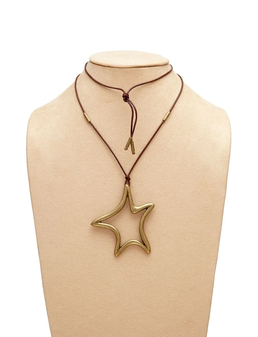 New Authentic Theodora and Callum Brass Brown Leather Cord Etoile Necklace: Title:New Authentic Theodora and Callum Brass Brown Leather Cord Etoile Necklace Description:Made of Brass Electroplated Pewter. Pendant on 43" Brown Leather Cord. Star Pendant Measures 3.25" x 3". We