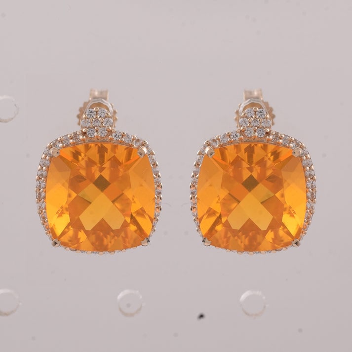 5.79 Ct Cushion Br.Opal 9K Gold Earrings: 5.79 Total Carat Br.Opal 9K Gold Earrings Specifications: Total Weight 2.847 g Center Gemstone Br.Opal Gemstone Carat Weight 5.47 Carats Gemstone Measurements 10X10 mm Additional Gemstones White Sapph