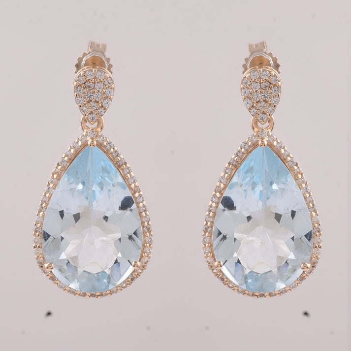 8.07 Ct Pear Aquamarine 9K Gold Earrings: 8.07 Total Carat Aquamarine 9K Gold Earrings Specifications: Total Weight 3.768 g Center Gemstone Aquamarine Gemstone Carat Weight 7.6 Carats Gemstone Measurements 15X10 mm Additional Gemstones White 
