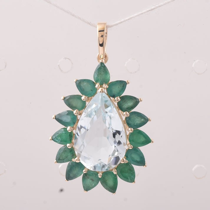 5.68 Ct Pear Aquamarine 9K Gold Pendant: 5.68 Total Carat Aquamarine 9K Gold Pendant Specifications: Total Weight 2.936 g Center Gemstone Aquamarine Gemstone Carat Weight 3.61 Carats Gemstone Measurements 14X9X5.30 mm Additional Gemstones Em