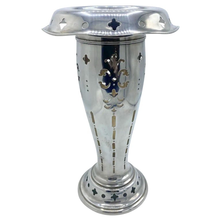 Antique Tiffany & Co Sterling Silver Vase: Title: Antique Tiffany & Co Sterling Silver Vase Description: The vase is created by Tiffany & Co., it is made out of 925/ 1000 sterling silver. The vase features floral and geometric cut outs design.