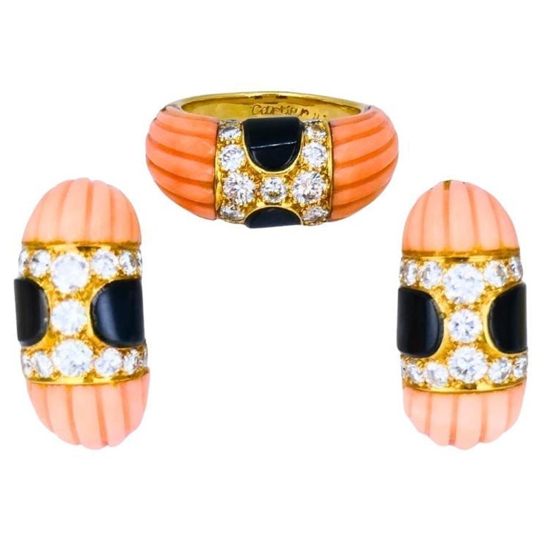 Vintage Cartier Set Coral Onyx Diamond 18k Gold Ring and Earrings Estate Jewelry: Title: Vintage Cartier Set Coral Onyx Diamond 18k Gold Ring and Earrings Estate Jewelry Description: A vintage Cartier set consisting of a ring and matching earrings. The set is made of 18k gold, cora