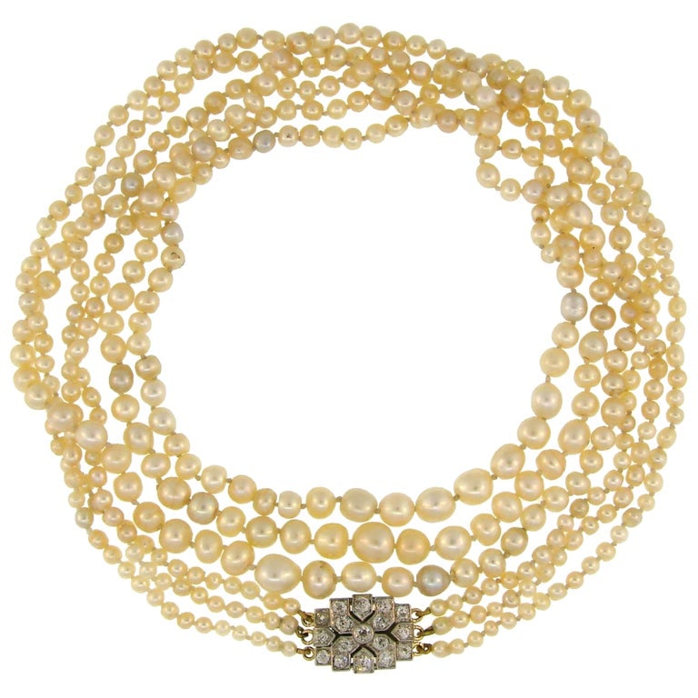 Victorian Natural Saltwater Pearl Necklace with Diamond Clasp: Title: Victorian Natural Saltwater Pearl Necklace with Diamond Clasp Description: Victorian natural pearl necklace with a gorgeous clasp. Features three strands of natural pearls culminating with a di