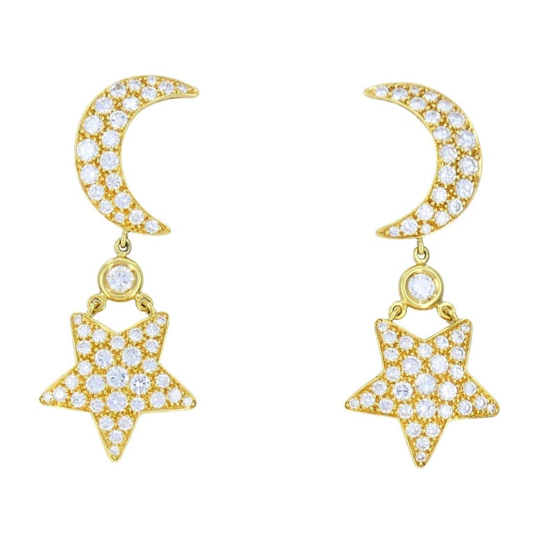 Mouawad 18k Gold Diamond Moon Star Celestial Drop Earrings: Title: Mouawad 18k Gold Diamond Moon Star Celestial Drop Earrings Description: These vintage Mouawad earrings feature a celestial design crafted in 18k yellow gold, stamped 750, Mouawad, and a