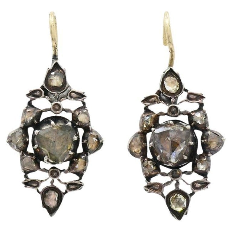 Georgian Diamond Earrings Gold Silver Floral Design: Title: Georgian Diamond Earrings Gold Silver Floral Design Description: These Georgian era earrings showcase the refined craftsmanship of the late 18th to early 19th century. Made of gold and silver, 