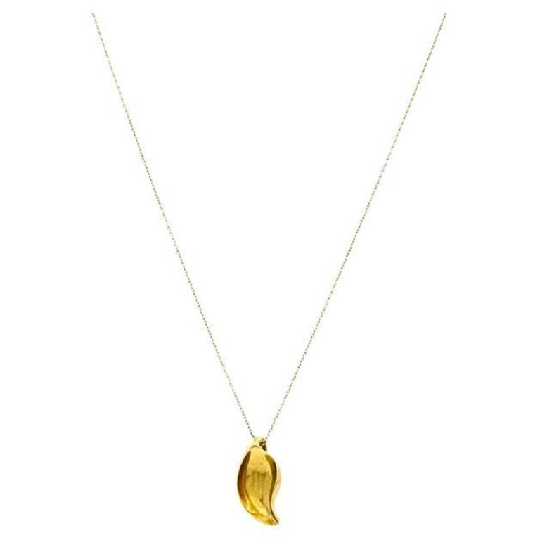 Elsa Peretti Tiffany & Co. 18k Gold Calla Lily Pendant Necklace: Title: Elsa Peretti Tiffany & Co. 18k Gold Calla Lily Pendant Necklace Description: DESIGNER: Elsa Peretti for Tiffany & Co. CIRCA: 1980s MATERIALS: 18K Gold WEIGHT: 5.3 Grams MEASUREMENTS: Chain - 17