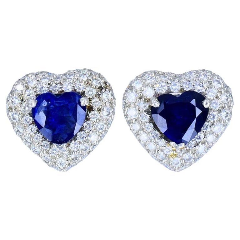 Vintage Heart Shaped Earrings Platinum Diamond Heart Cut Sapphire Estate Jewelry: Title: Vintage Heart Shaped Earrings Platinum Diamond Heart Cut Sapphire Estate Jewelry Description: These vintage earrings feature a heart-cut sapphire in a deep blue hue, set in a platinum