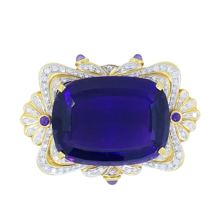 Vintage 18k Two-tone Gold Siberian Amethyst Diamond Pin Brooch: Title: Vintage 18k Two-tone Gold Siberian Amethyst Diamond Pin Brooch Description: This vintage 18k two-tone gold brooch features a striking Siberian amethyst centerpiece in a cushion cut, framed by
