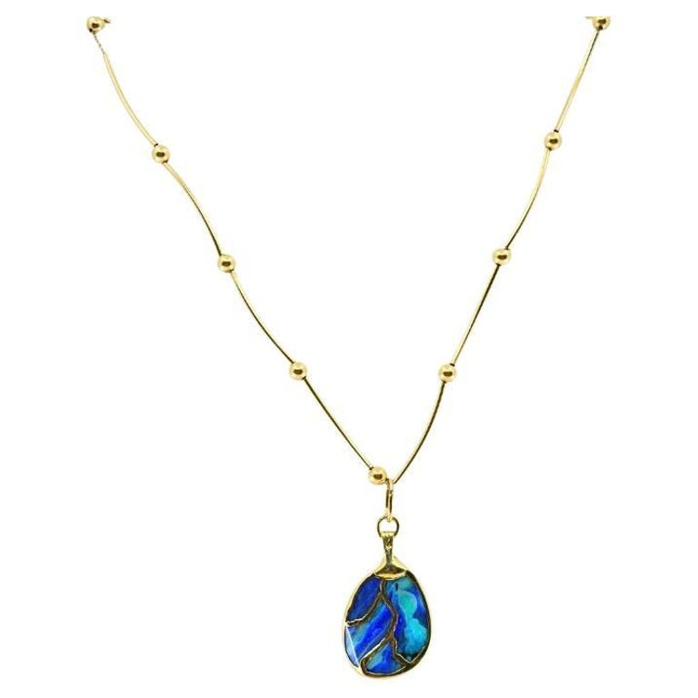 Opal Necklace 14k Gold Collar Necklace with Beads: Title: Opal Necklace 14k Gold Collar Necklace with Beads Description: An opal necklace, featuring a 14k gold chain accented by small gold beads. The centerpiece is an opal pendant with unique swirls
