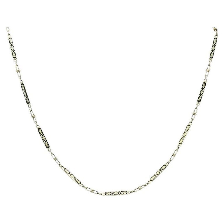 14k White Gold Chain Necklace Black Enamel: Title: 14k White Gold Chain Necklace Black Enamel Description: This vintage 14k white gold chain necklace features a delicate series of elongated, rectangular links decorated with black enamel in a