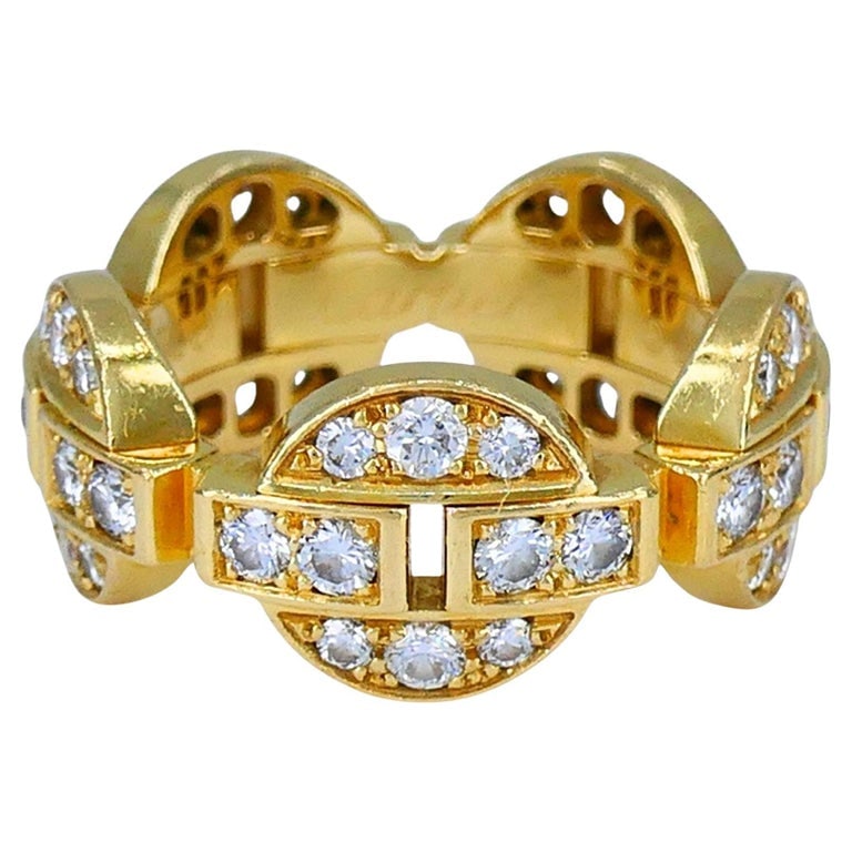 Cartier Himalia 18k Gold Diamond Band Ring: Title: Cartier Himalia 18k Gold Diamond Band Ring Description: A vintage Cartier ring from the Himalia collection, crafted in 18k yellow gold with a structured, interlocking design. The band features 