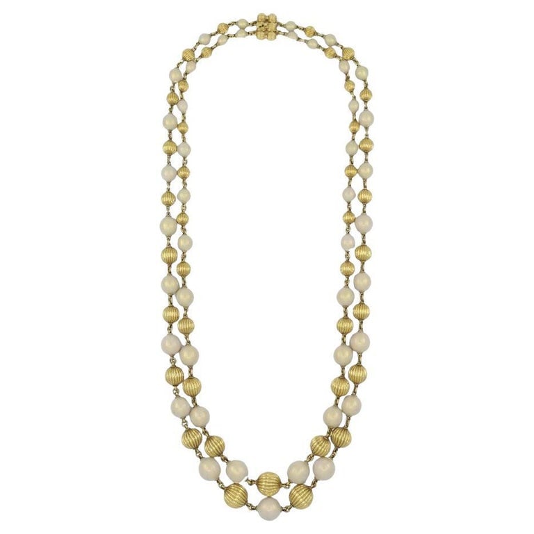 Vintage Tiffany & Co. 18k Gold Enamel Beaded Necklace: Title: Vintage Tiffany & Co. 18k Gold Enamel Beaded Necklace Description: This vintage Tiffany & Co. double strand beaded necklace is crafted in 18k yellow gold with alternating white enamel beads. Th