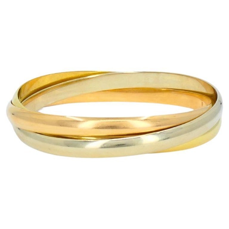 Cartier Trinity Bracelet 18k Yellow White Rose Gold Estate Jewelry: Title: Cartier Trinity Bracelet 18k Yellow White Rose Gold Estate Jewelry Description: An iconic Cartier Trinity bracelet made of 18k yellow, white, and rose gold. The Cartierâ€™s Tri