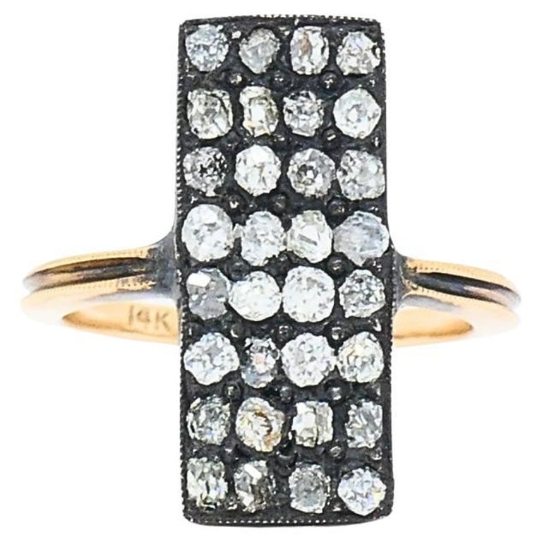 Victorian Revival Diamond Ring 14k Gold: Title: Victorian Revival Diamond Ring 14k Gold Description: A Victorian revival diamond ring made of 14k gold. This rectangular ring brings together old-world charm with a structured design. The gold 
