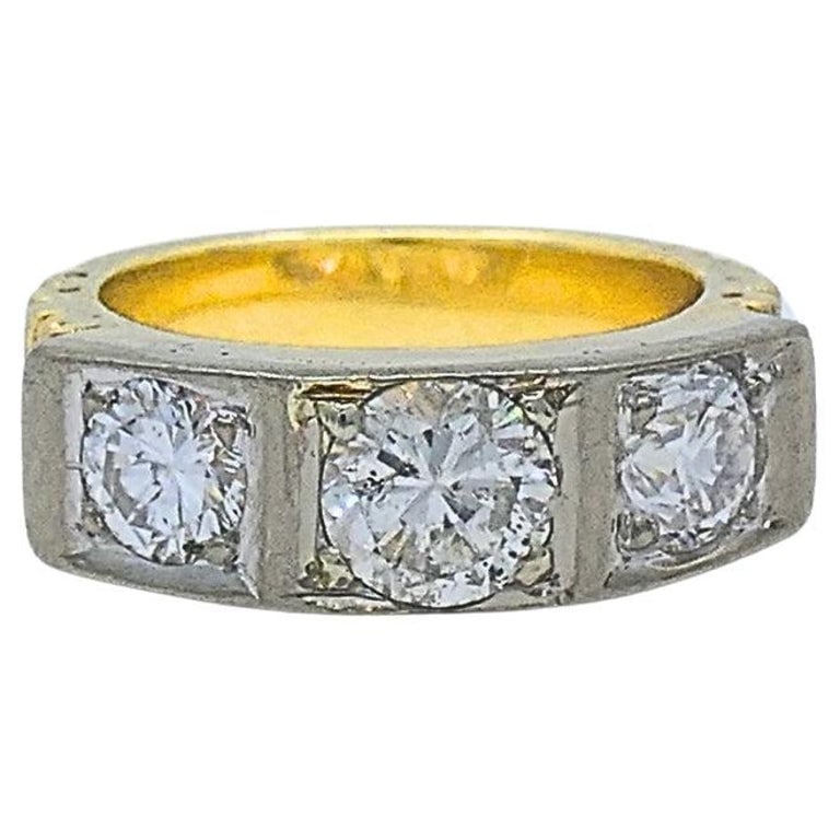 Vintage Three Stone Diamond Ring 14k Gold: Title: Vintage Three Stone Diamond Ring 14k Gold Description: A vintage three stone diamond ring made of white and yellow 14k gold. The squared band gives a strong look to this well-balanced design. T